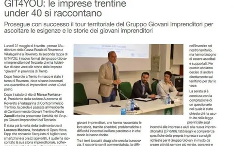 Ritaglio di giornale sulla tappa di Rovereto di GIT4YOU, con la foto di un relatore in piedi accanto al tavolo degli ospiti in auditorium